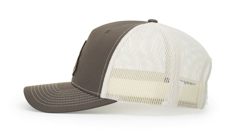 Brown and white trucker cap on a white background