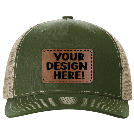 Green and beige trucker cap with a brown leather patch that says 'Your Design Here'.