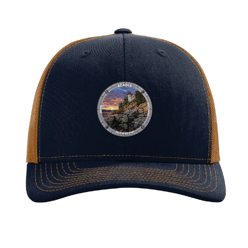 Acadia National Park patch hat in Navy/Caramel — Bass Harbor Head Lighthouse badge on a Richardson 112 trucker cap