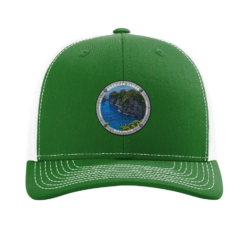 American Samoa National Park patch hat in Kelly Green/White — jungle sea cliffs badge on a Richardson 112 trucker cap