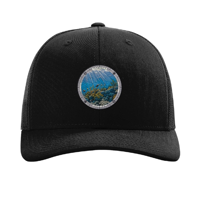 Biscayne National Park patch hat in Black — coral reef badge on a Richardson 112 trucker cap