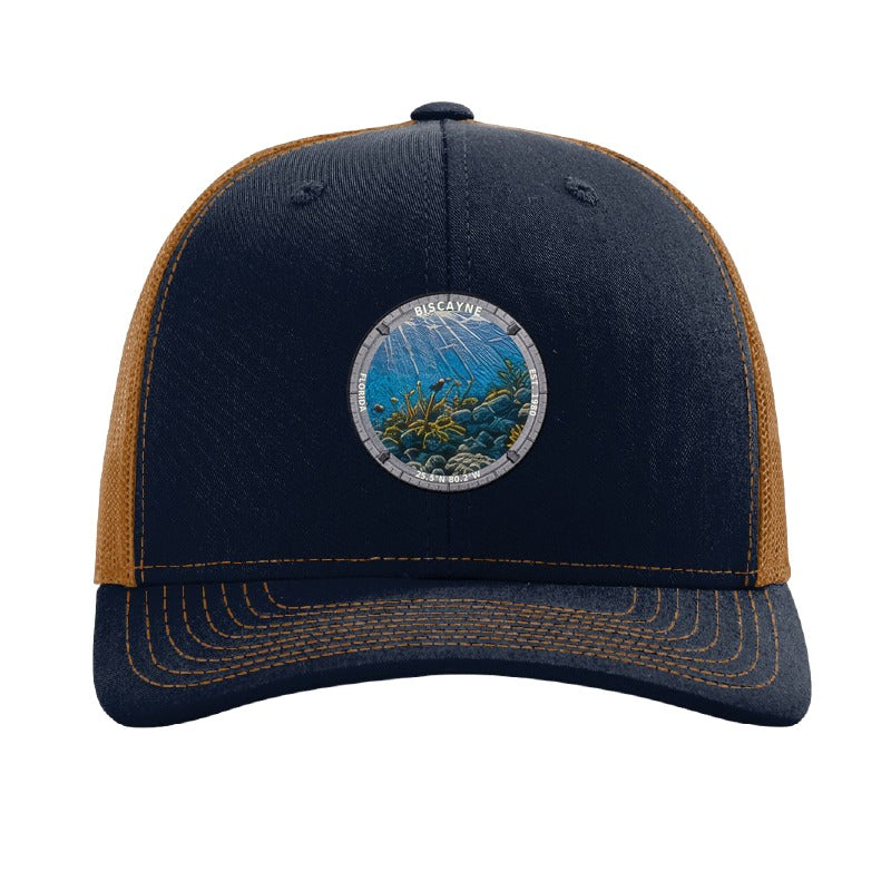 Biscayne National Park patch hat in Navy/Caramel — coral reef badge on a Richardson 112 trucker cap
