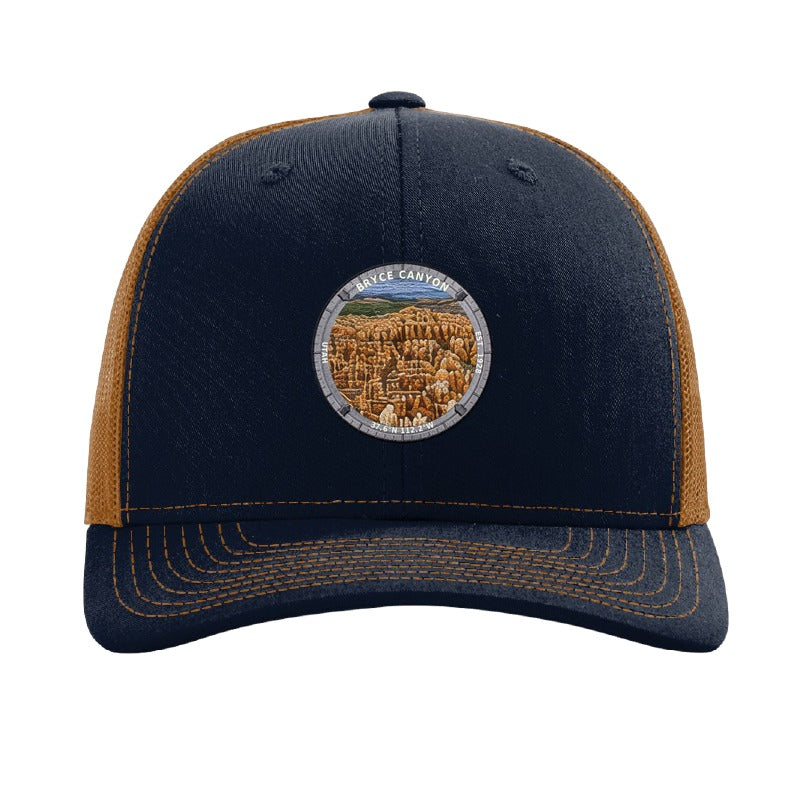 Bryce Canyon National Park patch hat in Navy/Caramel — hoodoo amphitheatre badge on a Richardson 112 trucker cap