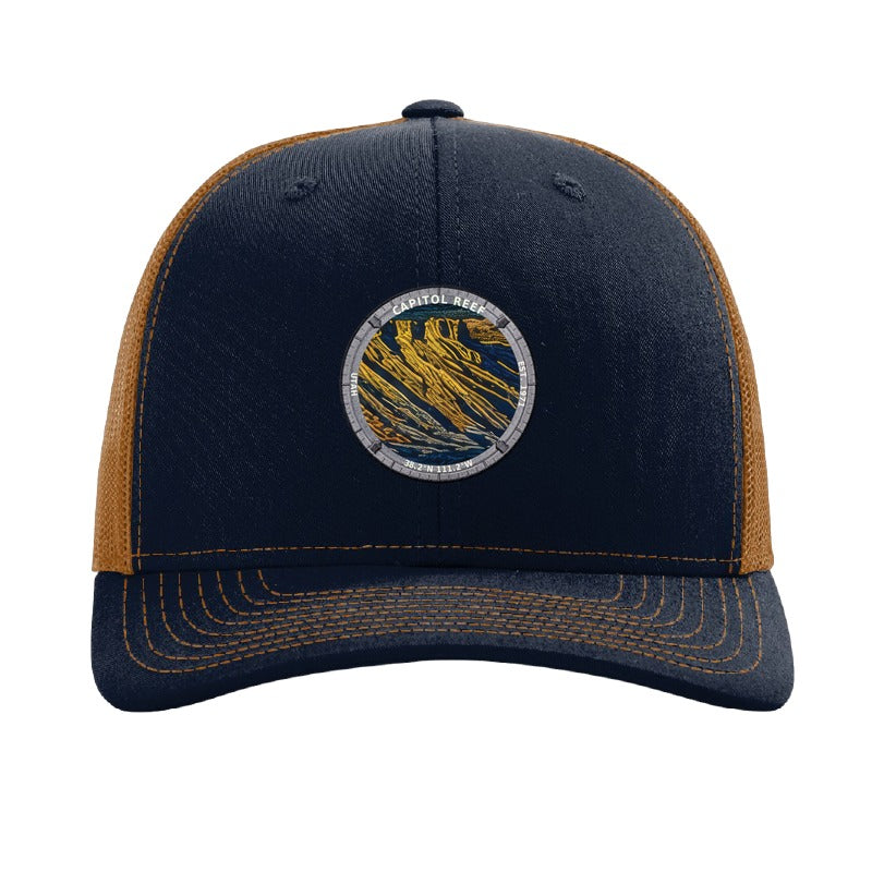 Capitol Reef National Park patch hat in Navy/Caramel — folded sandstone strata badge on a Richardson 112 trucker cap