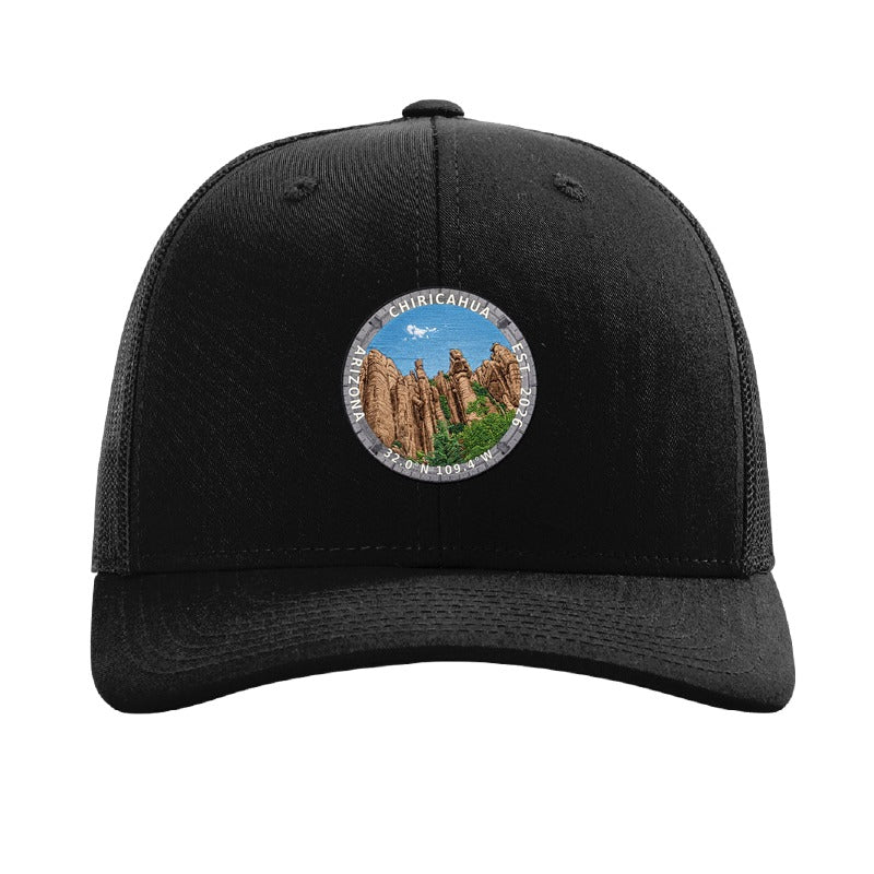 Chiricahua National Park patch hat in Black — standing rock columns badge on a Richardson 112 trucker cap