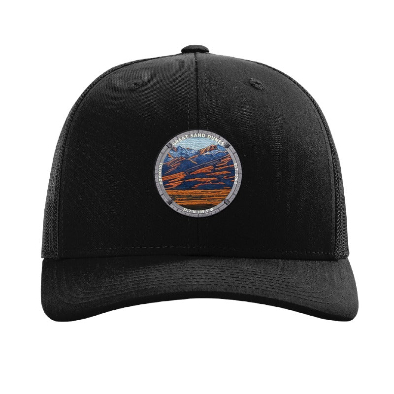 Great Sand Dunes National Park patch hat in Black — dunes below the Sangre de Cristos badge on a Richardson 112 trucker cap