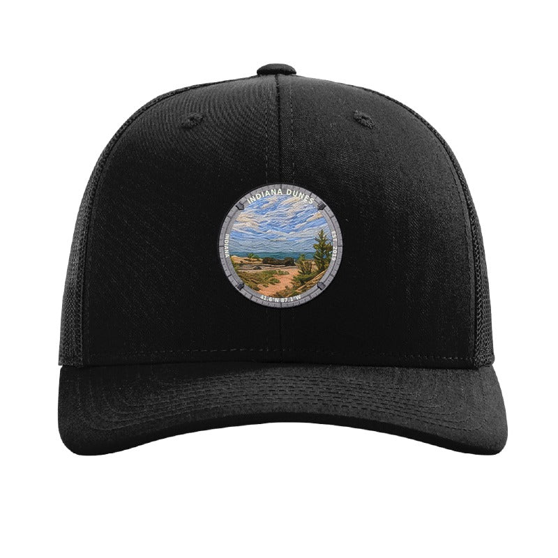 Indiana Dunes National Park patch hat in Black — Lake Michigan dune shoreline badge on a Richardson 112 trucker cap
