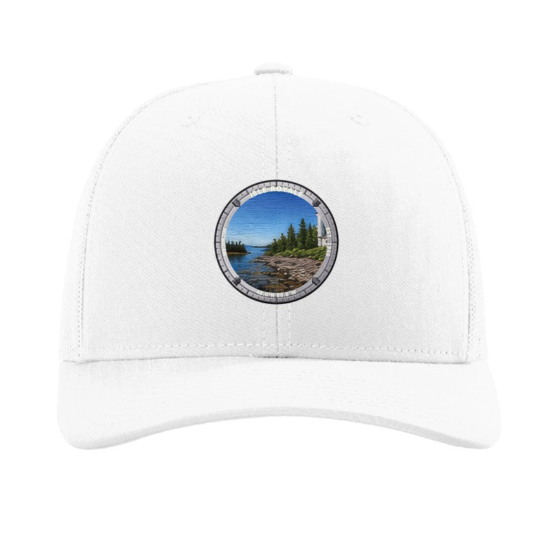 Isle Royale National Park patch hat in White — Rock Harbor Lighthouse badge on a Richardson 112 trucker cap
