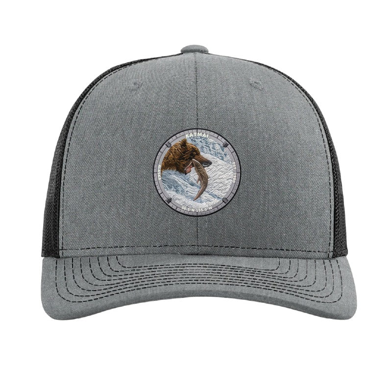 Katmai National Park patch hat in Heather Grey/Black — brown bear catching salmon at Brooks Falls badge on a Richardson 112 trucker cap