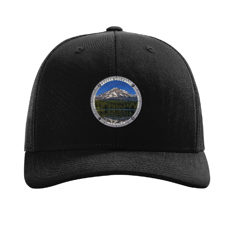 Lassen Volcanic National Park patch hat in Black — Lassen Peak on Manzanita Lake badge on a Richardson 112 trucker cap