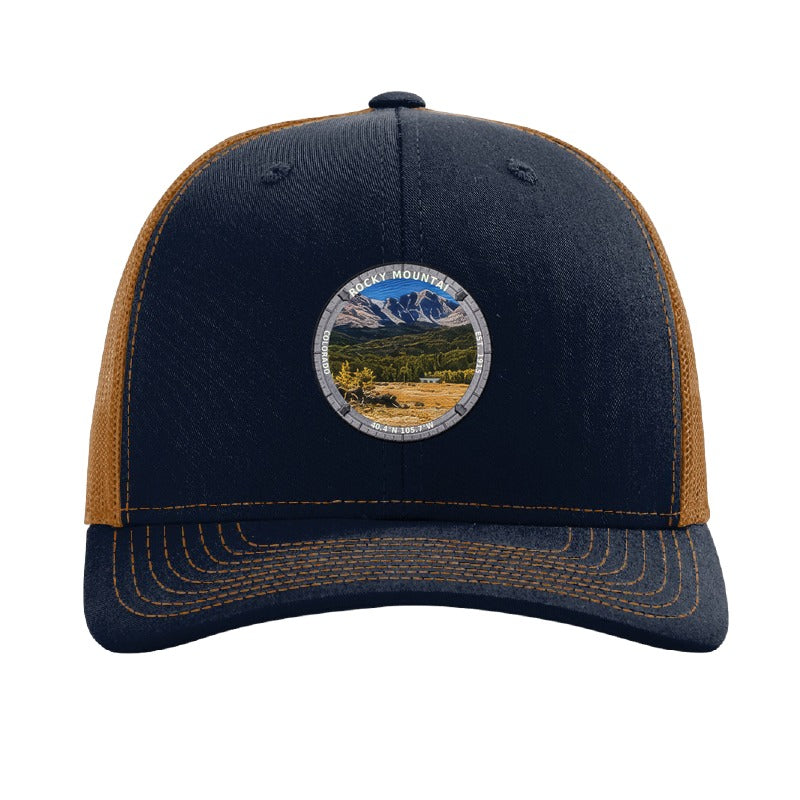 Rocky Mountain National Park patch hat in Navy/Caramel — Longs Peak with elk badge on a Richardson 112 trucker cap