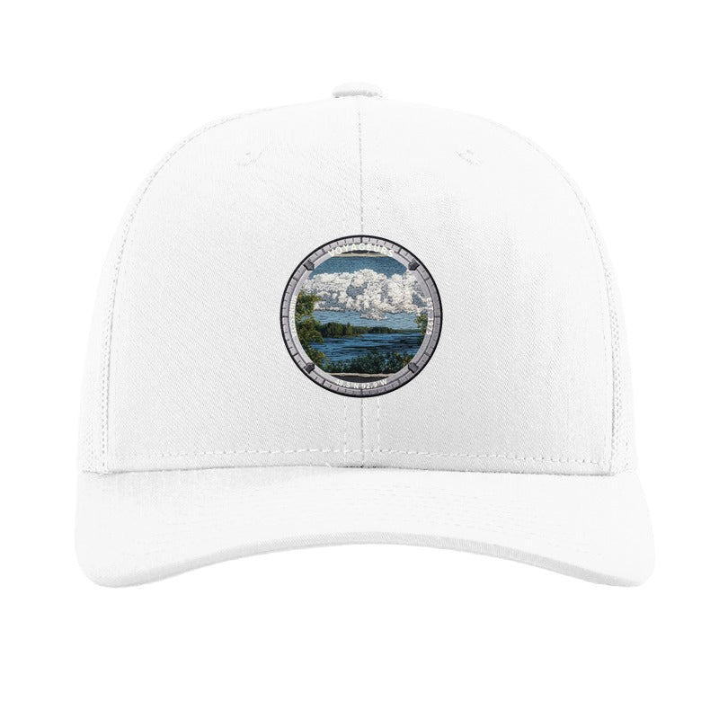 Voyageurs National Park patch hat in White — lake and pine shoreline badge on a Richardson 112 trucker cap