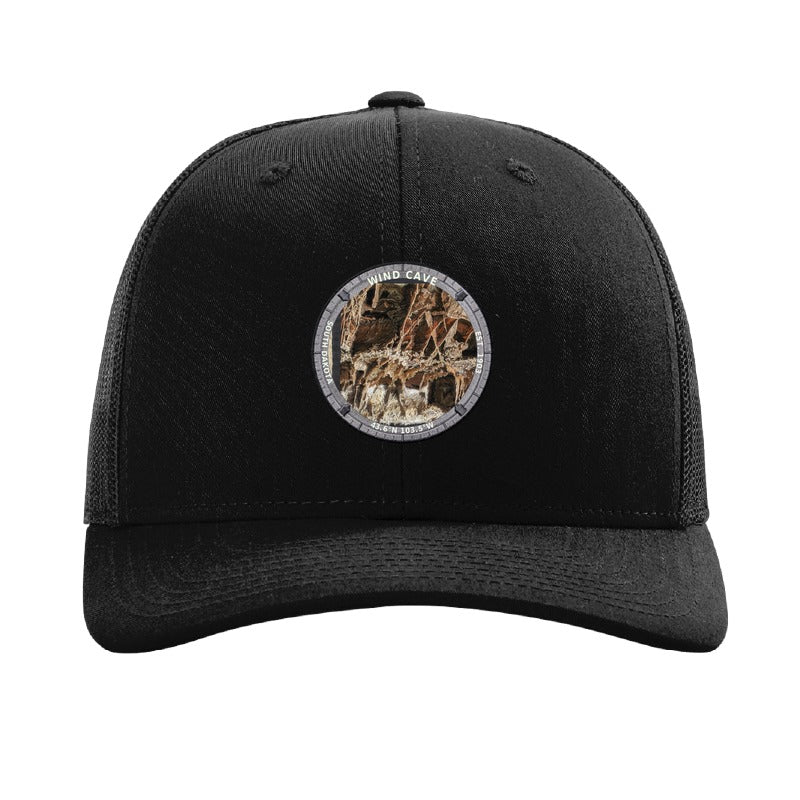 Wind Cave National Park patch hat in Black — boxwork calcite formation badge on a Richardson 112 trucker cap