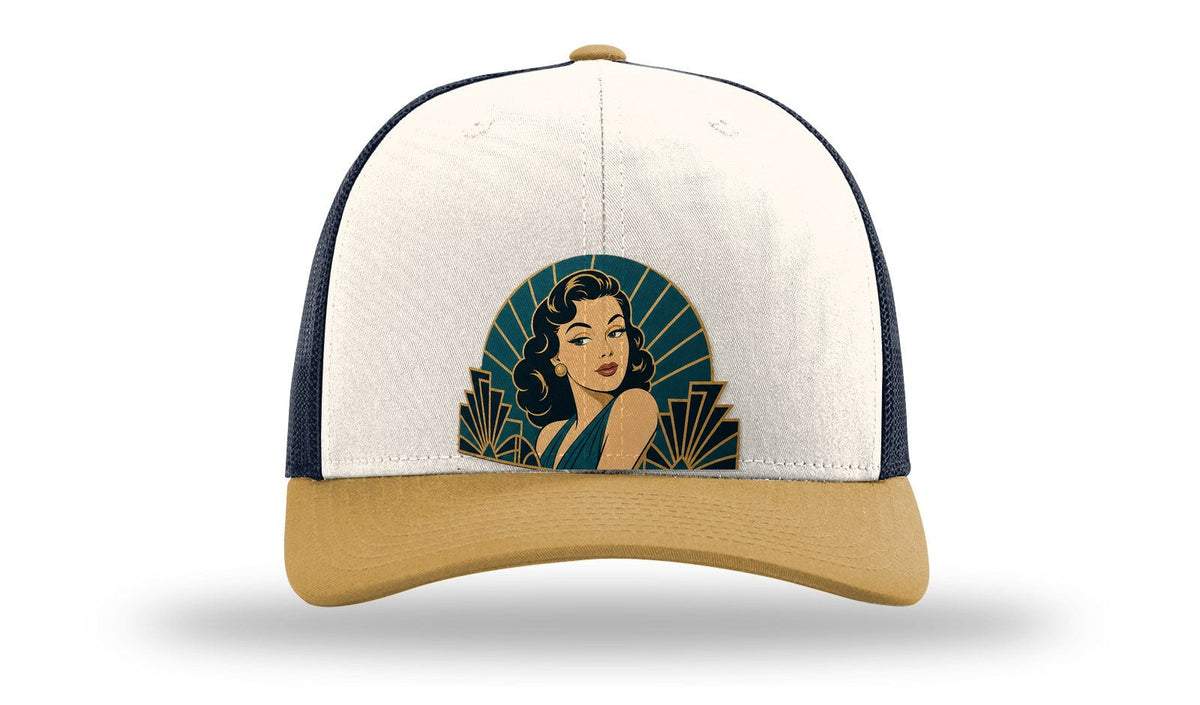 The Starlet art deco pin-up hat on a Richardson 112 trucker in Cream/Navy/Amber Gold