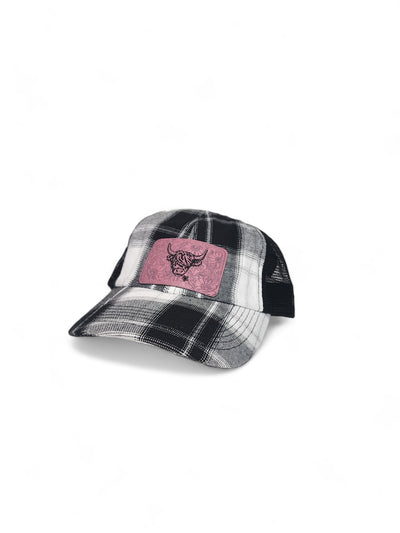 Black and white plaid trucker hat with a pink leather Highland cow patch
