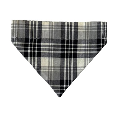 Plaid triangle-shaped object on a marble surface