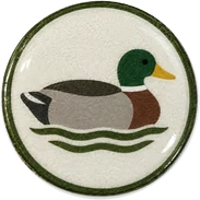 Duck decoy hat button side patch: a duck decoy on a white domed button. Guns & Hunt collection.