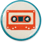 Cassette hat button side patch: a cassette on a white domed button. Western & Retro collection.