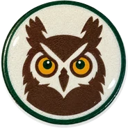 Horned owl hat button side patch: a horned owl on a white domed button. Field Guide Animals collection.