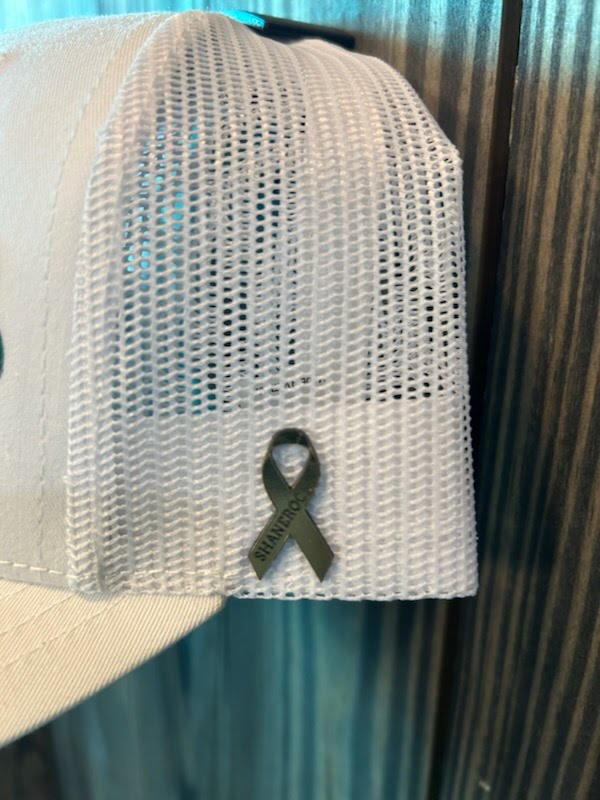 Close-up of the gold pediatric cancer awareness ribbon side patch with SHANEROCK engraved along it