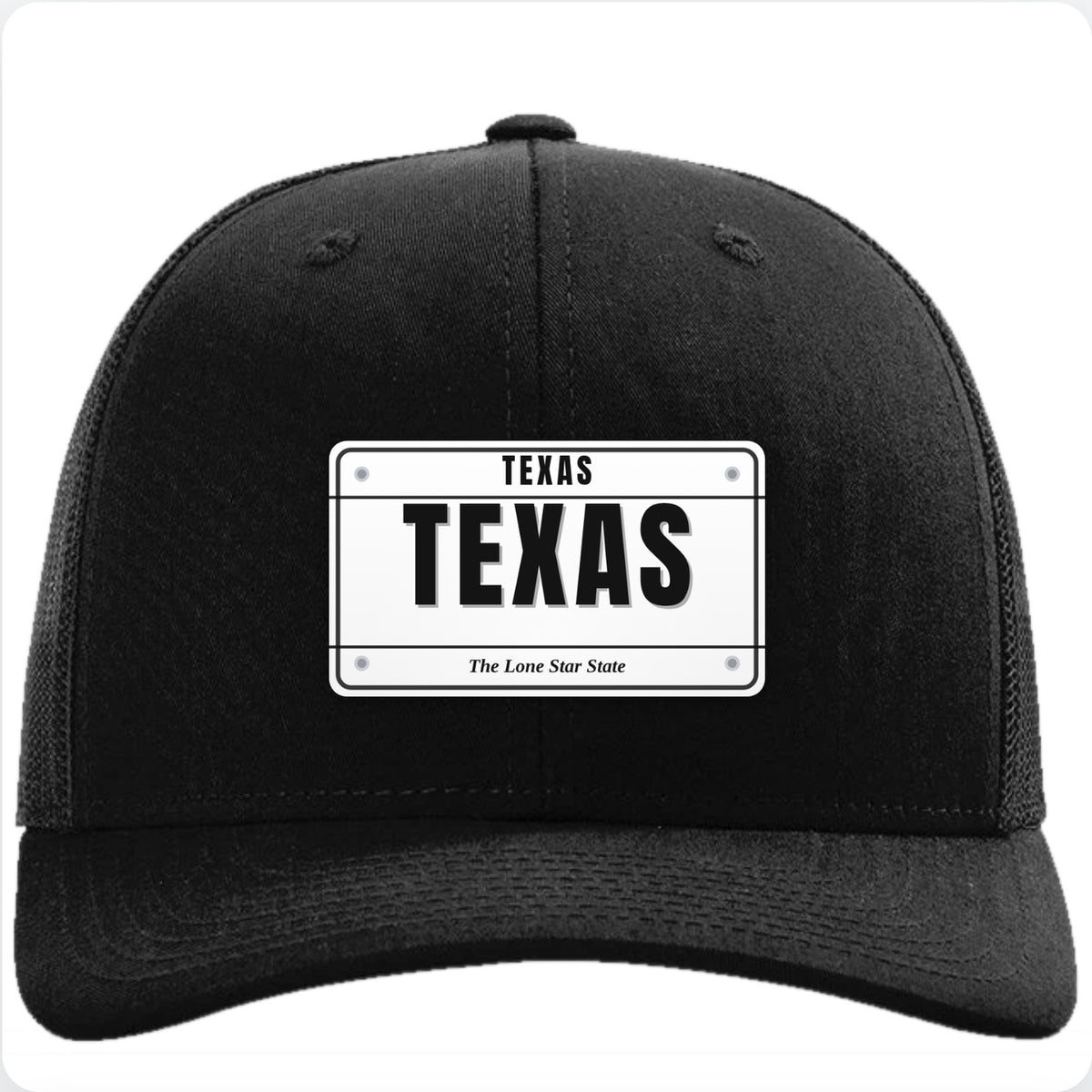 Black Richardson 112 trucker hat with a Texas license plate patch reading TEXAS in the state's own plate colors.