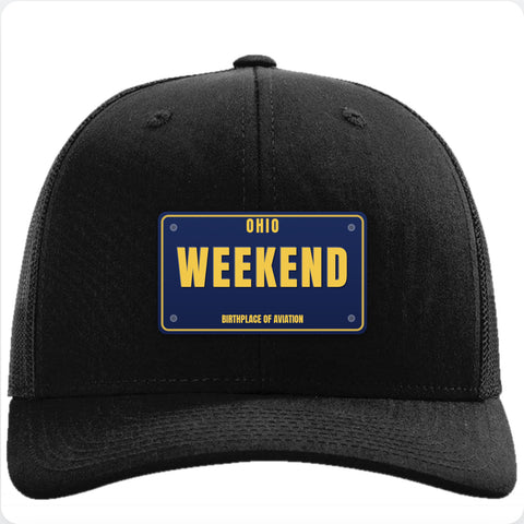 Black Richardson 112 trucker hat with a vintage navy license plate patch reading WEEKEND.