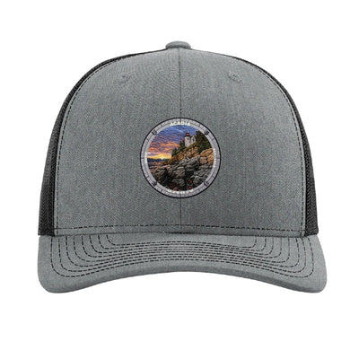 Acadia National Park patch hat in Heather Grey/Black — Bass Harbor Head Lighthouse badge on a Richardson 112 trucker cap