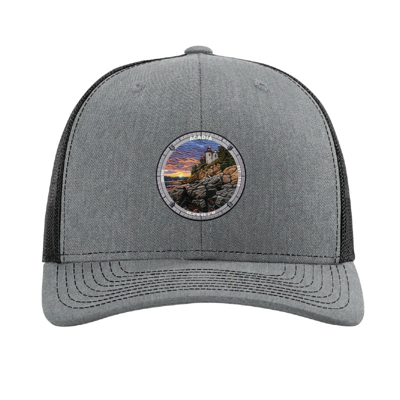 Acadia National Park patch hat in Heather Grey/Black — Bass Harbor Head Lighthouse badge on a Richardson 112 trucker cap