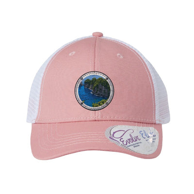 American Samoa National Park patch hat in Dusty Rose/White — jungle sea cliffs badge on an Infinity Charlie ponytail cap