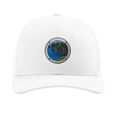 American Samoa National Park patch hat in White — jungle sea cliffs badge on a Richardson 112 trucker cap