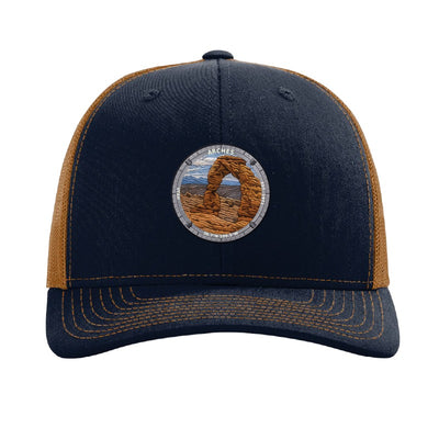 Arches National Park patch hat in Navy/Caramel — Delicate Arch badge on a Richardson 112 trucker cap