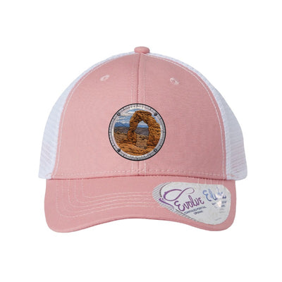 Arches National Park patch hat in Dusty Rose/White — Delicate Arch badge on an Infinity Charlie ponytail cap