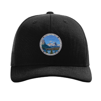 Glacier National Park patch hat in Black — Wild Goose Island badge on a Richardson 112 trucker cap