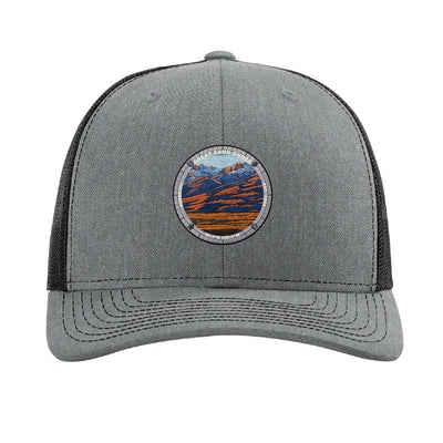 Great Sand Dunes National Park patch hat in Heather Grey/Black — dunes below the Sangre de Cristos badge on a Richardson 112 trucker cap