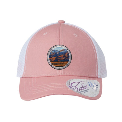Great Sand Dunes National Park patch hat in Dusty Rose/White — dunes below the Sangre de Cristos badge on an Infinity Charlie ponytail cap