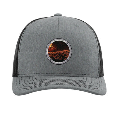 Hawaii Volcanoes National Park patch hat in Heather Grey/Black — lava flowing over black rock badge on a Richardson 112 trucker cap