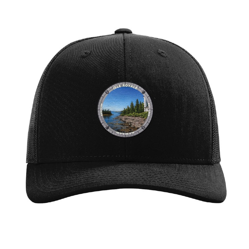 Isle Royale National Park patch hat in Black — Rock Harbor Lighthouse badge on a Richardson 112 trucker cap