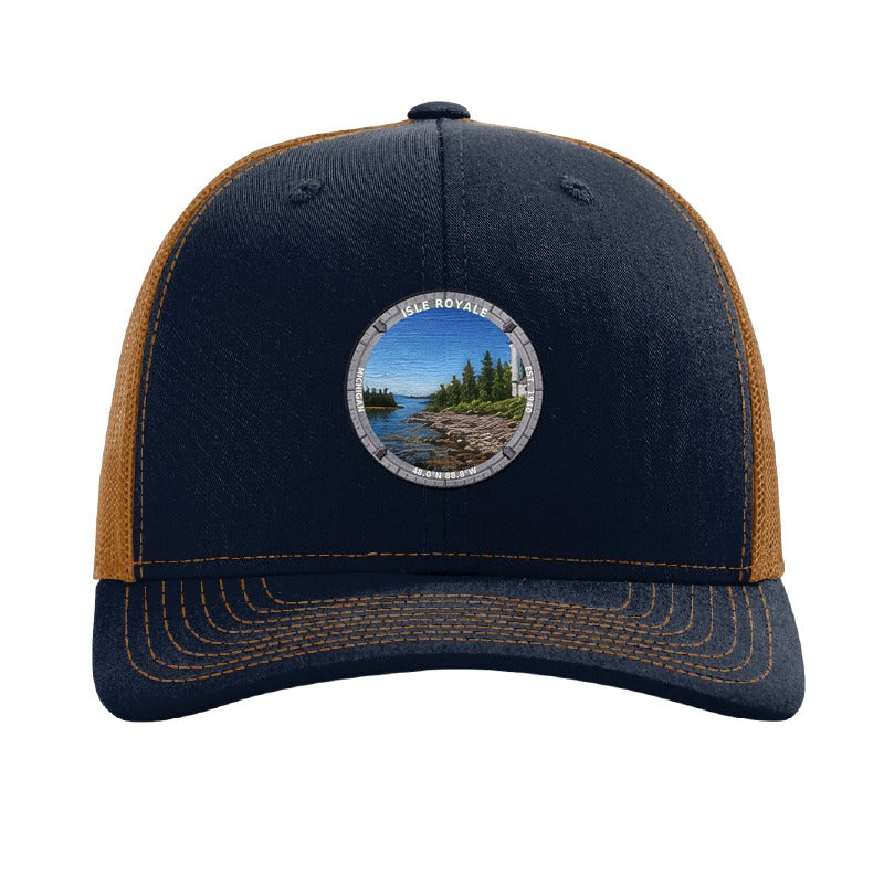 Isle Royale National Park patch hat in Navy/Caramel — Rock Harbor Lighthouse badge on a Richardson 112 trucker cap