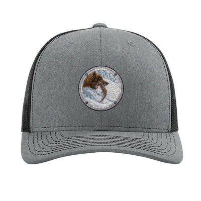 Katmai National Park patch hat in Heather Grey/Black — brown bear catching salmon at Brooks Falls badge on a Richardson 112 trucker cap
