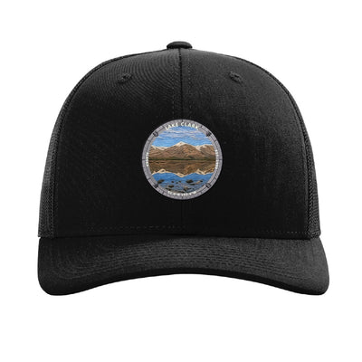 Lake Clark National Park patch hat in Black — turquoise lake below snow-capped peaks badge on a Richardson 112 trucker cap