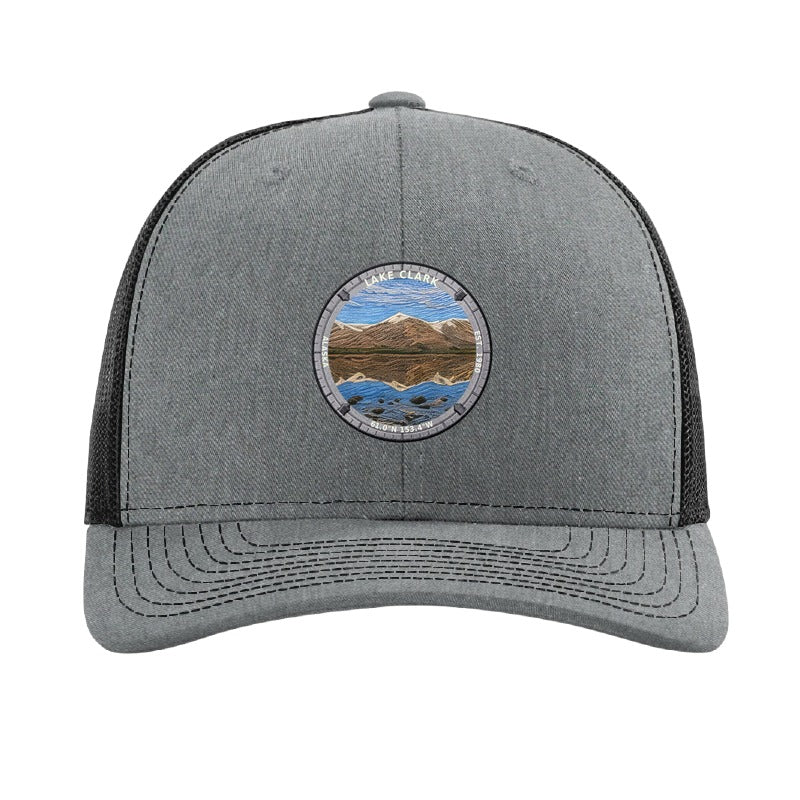 Lake Clark National Park patch hat in Heather Grey/Black — turquoise lake below snow-capped peaks badge on a Richardson 112 trucker cap