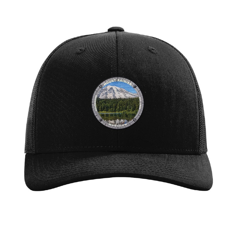 Mount Rainier National Park patch hat in Black — Rainier reflected in a lake badge on a Richardson 112 trucker cap