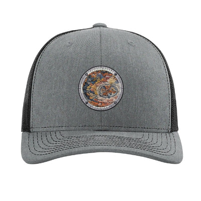 Petrified Forest National Park patch hat in Heather Grey/Black — petrified log cross-section badge on a Richardson 112 trucker cap