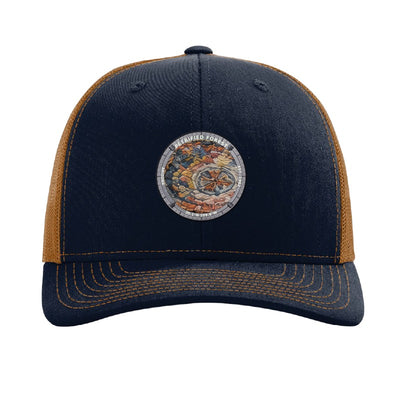 Petrified Forest National Park patch hat in Navy/Caramel — petrified log cross-section badge on a Richardson 112 trucker cap