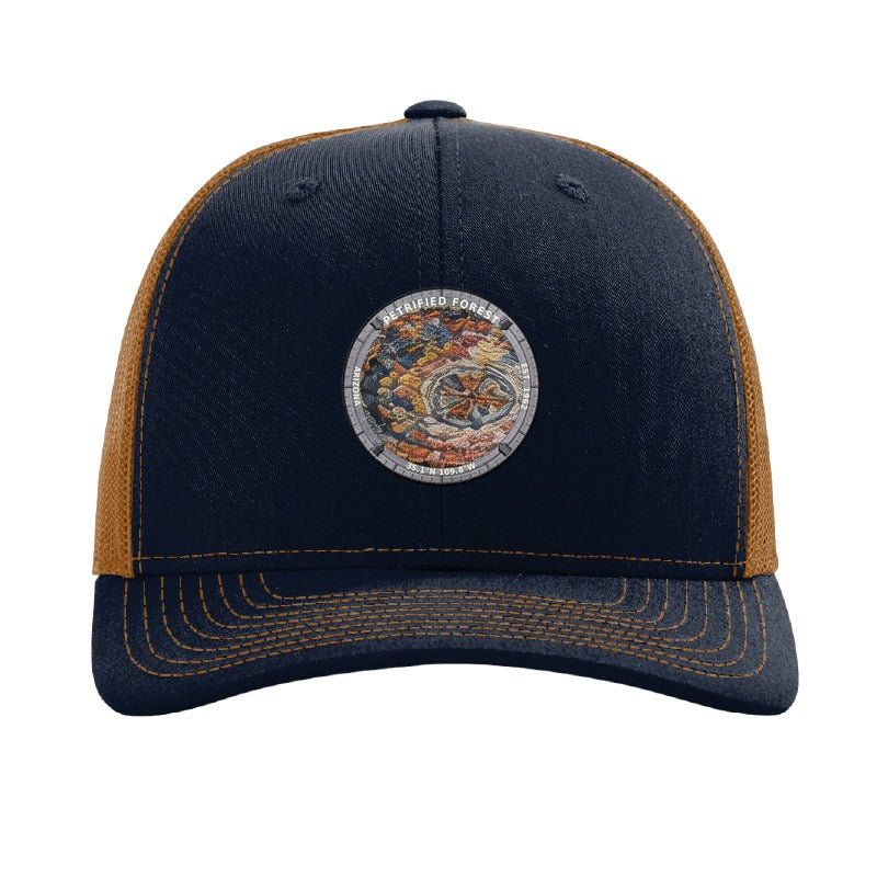 Petrified Forest National Park patch hat in Navy/Caramel — petrified log cross-section badge on a Richardson 112 trucker cap