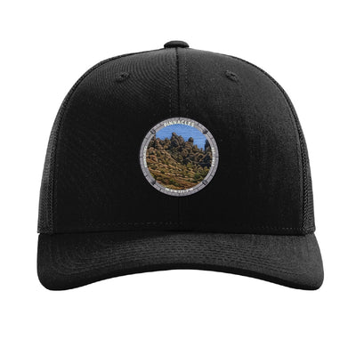 Pinnacles National Park patch hat in Black — volcanic rock spires badge on a Richardson 112 trucker cap