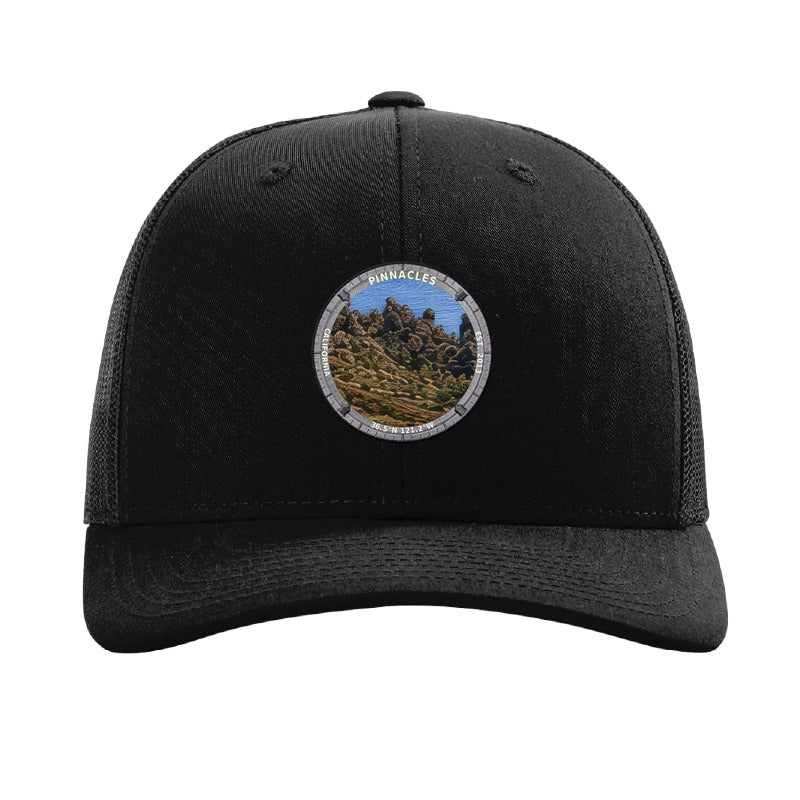 Pinnacles National Park patch hat in Black — volcanic rock spires badge on a Richardson 112 trucker cap