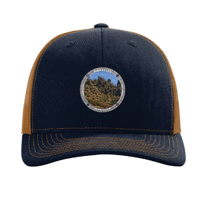 Pinnacles National Park patch hat in Navy/Caramel — volcanic rock spires badge on a Richardson 112 trucker cap