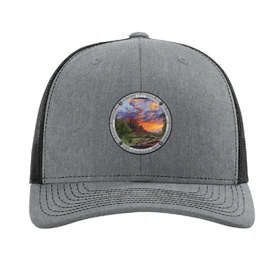 Zion National Park patch hat in Heather Grey/Black — red sandstone cliffs at sunset badge on a Richardson 112 trucker cap