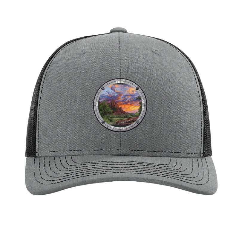Zion National Park patch hat in Heather Grey/Black — red sandstone cliffs at sunset badge on a Richardson 112 trucker cap